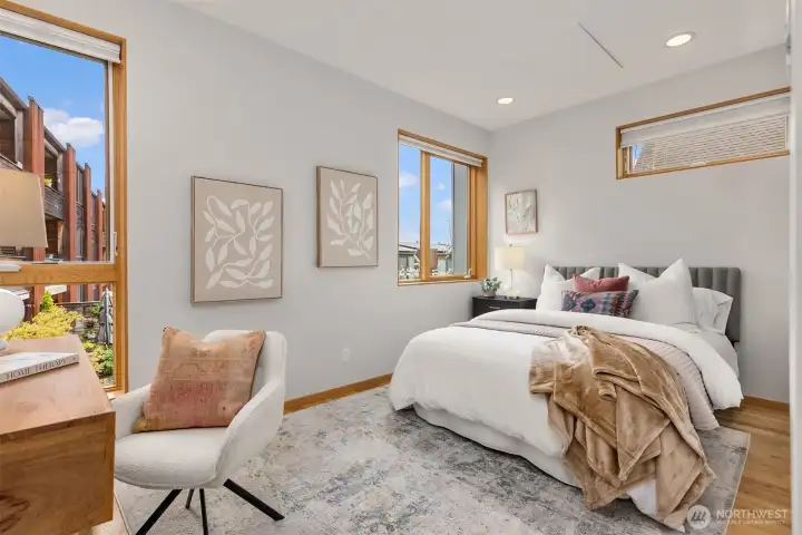 The second bedroom faces east and enjoys open views of the grounds and plenty of sky.