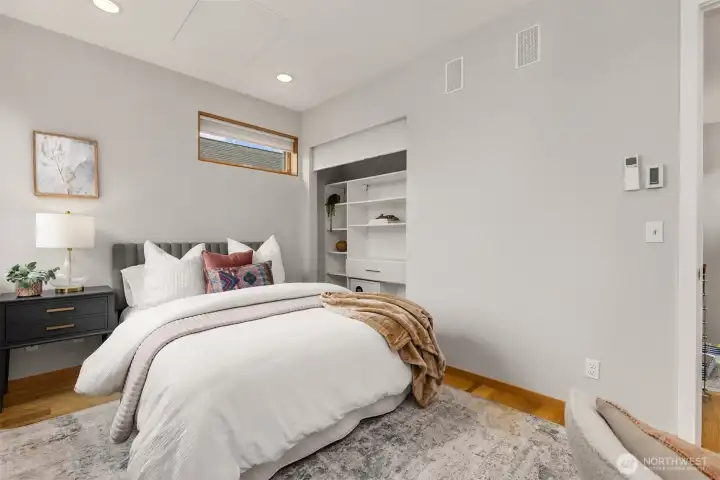 The second bedroom is large enough to serve as a guest room and an office.