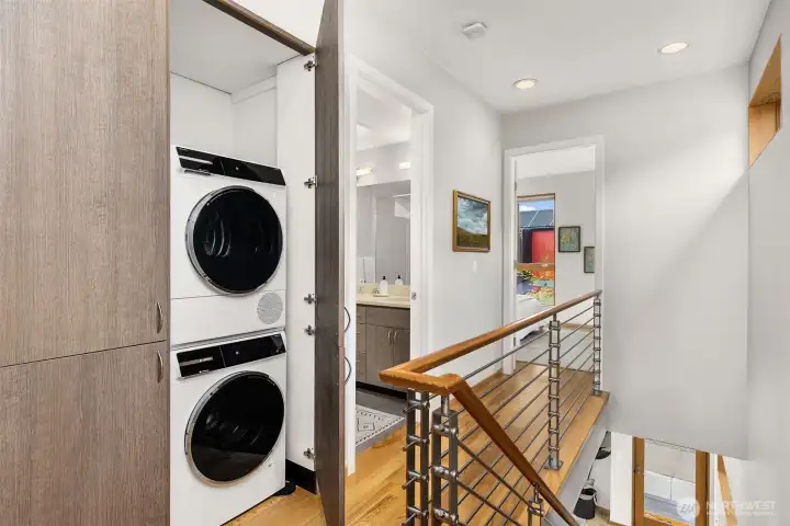 Convenient laundry center with updated full-size washer and dryer.