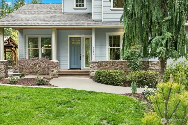 The large covered front porch offers a dry place to come inside, and there is easy access for guests to join in the fun on the covered deck off of the formal dining room.