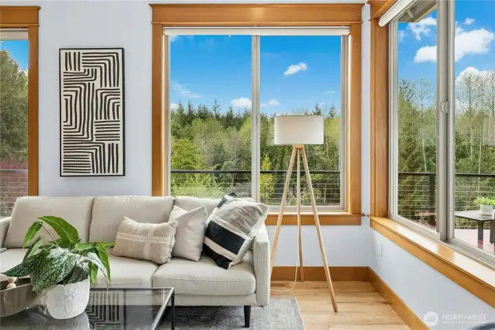 Expansive western views with big sky and lush greenery blur the line between indoor and outdoor spaces.