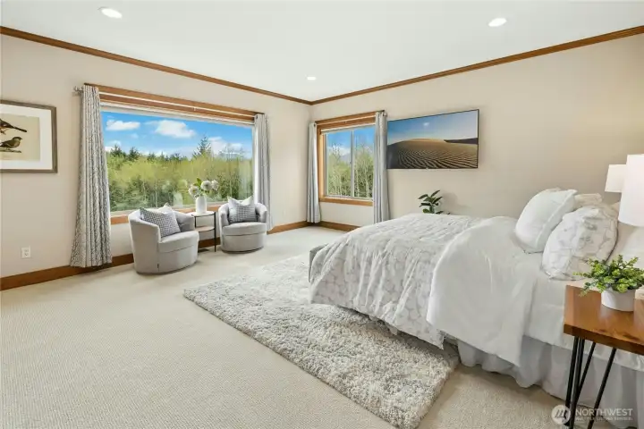 Heading upstairs. Relax and unwind in the spectacular primary suite, with sweeping territorial and Olympic Mountain views.