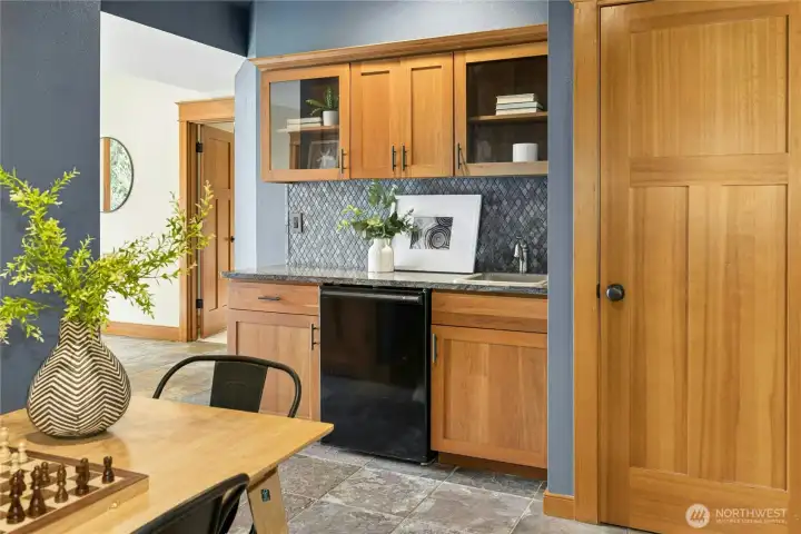 Heading down to the lower level. The wet bar makes for a great coffee station for guests, or staging area to bring food and drinks outside.