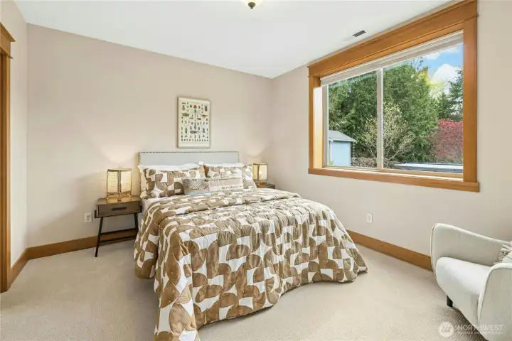 The first of two lower level bedrooms comes with its own en suite bathroom and walk-in closet.