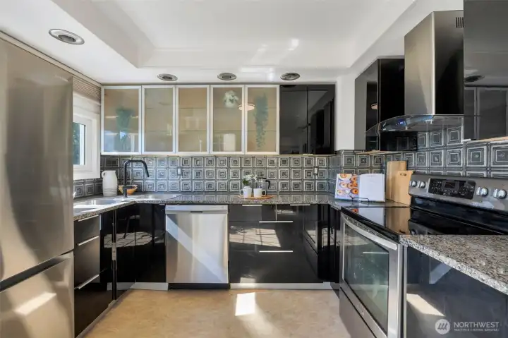Sleek cabinetry complete with built in spice rack