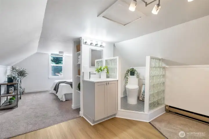 Eclectic half bath makes this primary suite convenient