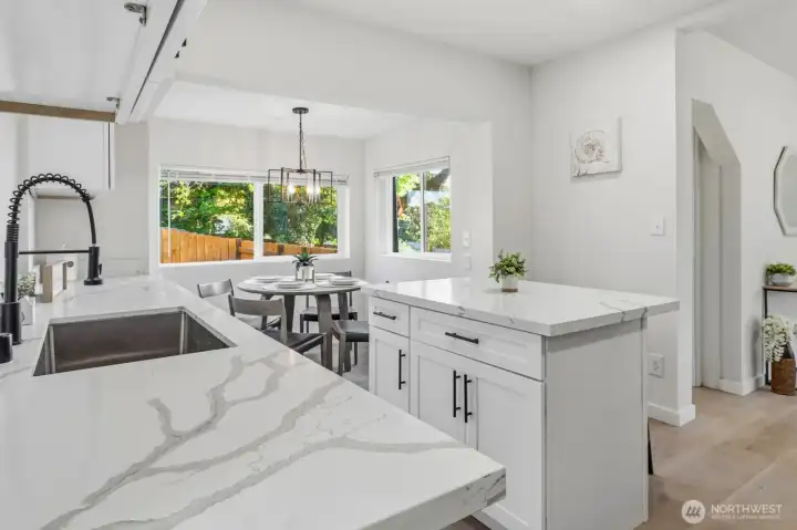 The brand new kitchen features quartz countertops and stainless steel appliances, perfect for everyday living and entertaining.