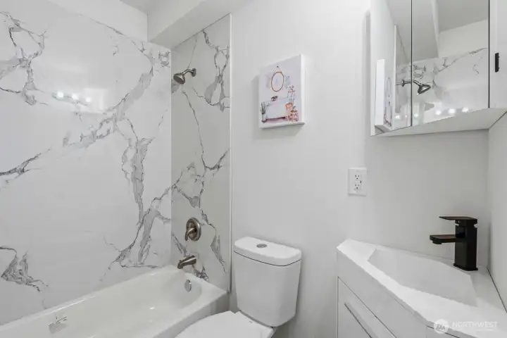 Main floor full bathroom is beautifully remodeled