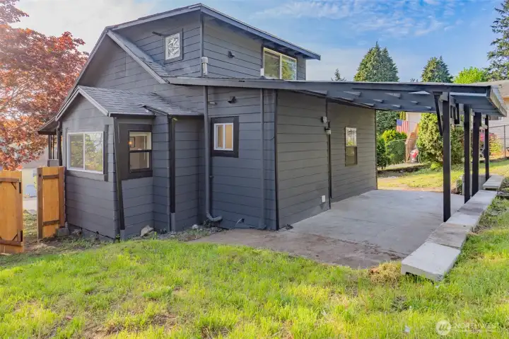 Nearly a quarter acre of fully fenced outdoor space ready for whatever you envision. Garden, gather, or unwind year round under the covered patio.