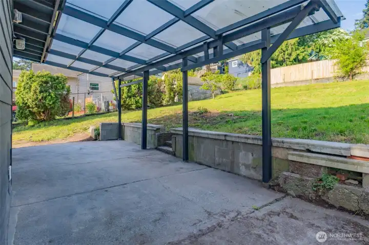 Nearly a quarter acre of fully fenced outdoor space ready for whatever you envision. Garden, gather, or unwind year round under the covered patio.