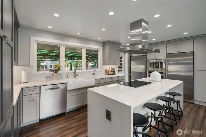 Oversized island with seating and modern power outlets