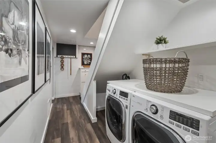 Laundry at base of stairs and added storage pantry understairs.