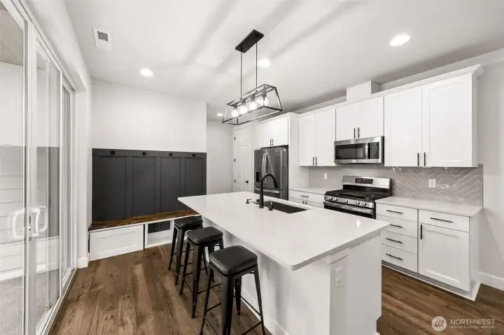 Well appointed kitchen with built in bench for your shoes and coats as you come in from the garage Well appointed kitchen with built in bench for your shoes and coats as you come in from the garage