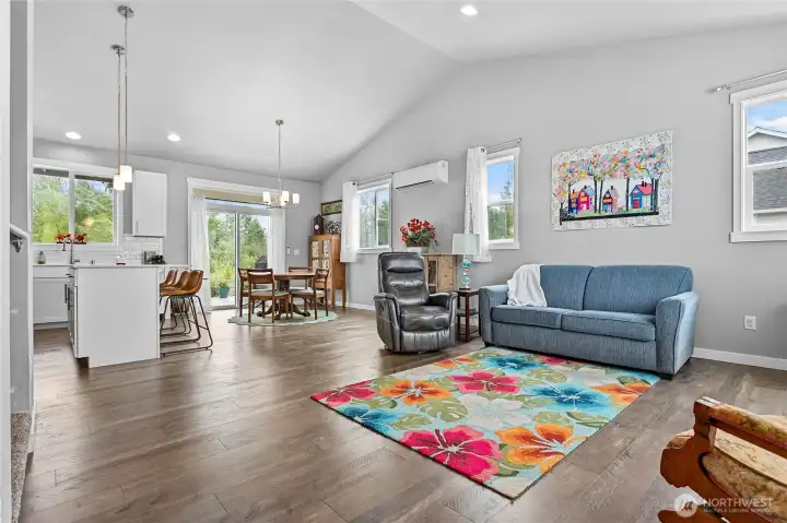 Open concept living with vaulted ceiling.
