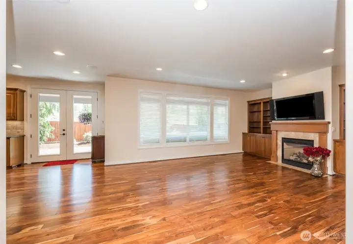 Family room offers built in bookshelves with electrical outlets, gas fireplace, and acacia hardwoods, surround sound. Private back yard with 14' hydropool swim spa Family room offers built in bookshelves with electrical outlets, gas fireplace, and acacia hardwoods, surround sound. Private back yard with 14' hydropool swim spa