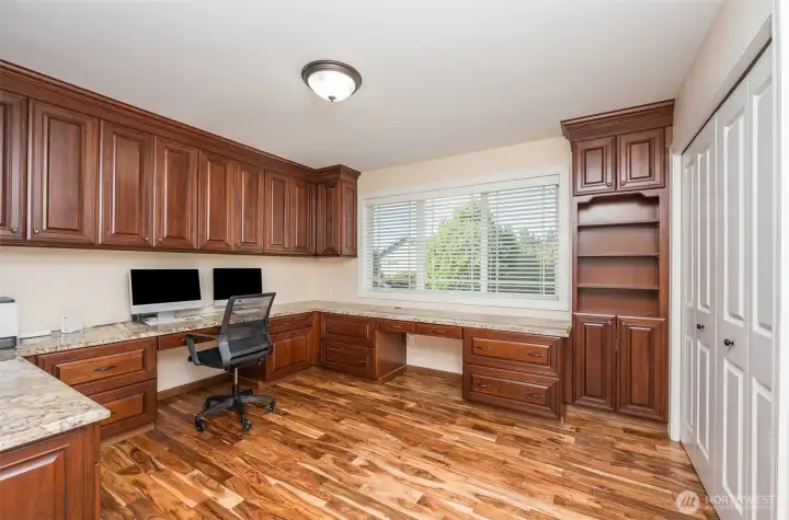 Custom cherry wood raised panel soft close cabinets and bookshelves, new acacia hardwoods, granite slab counter and 2 seating areas plus a full closet with shelving Custom cherry wood raised panel soft close cabinets and bookshelves, new acacia hardwoods, granite slab counter and 2 seating areas plus a full closet with shelving