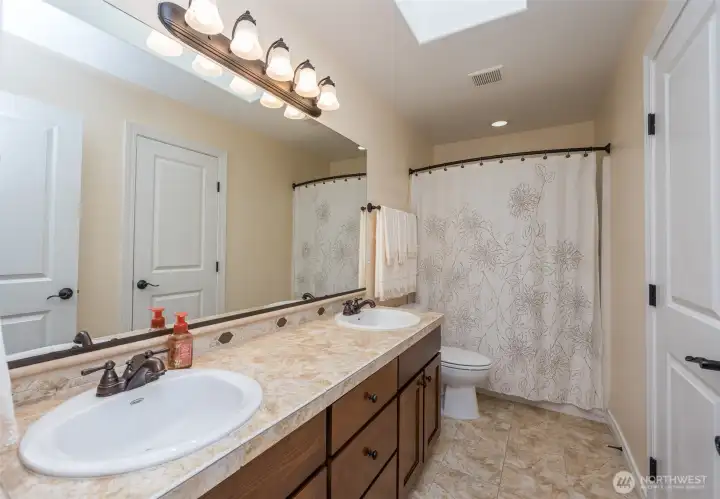 Full guest bath of Junior Suite tiles floors and counters and the convenience of toe kick under counter lighting. Enjoy the skylight for all the natural lighting Full guest bath of Junior Suite tiles floors and counters and the convenience of toe kick under counter lighting. Enjoy the skylight for all the natural lighting