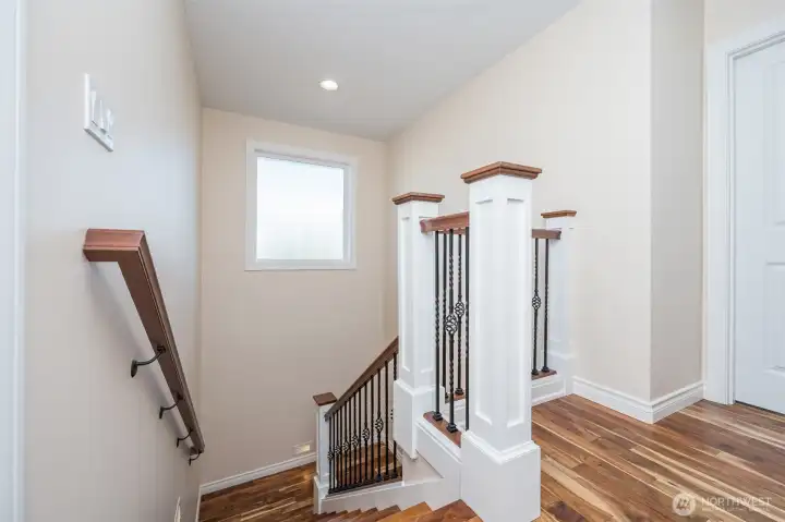 New acacia hardwoods, elegant rod iron railings, wood railings and detailed millwork New acacia hardwoods, elegant rod iron railings, wood railings and detailed millwork