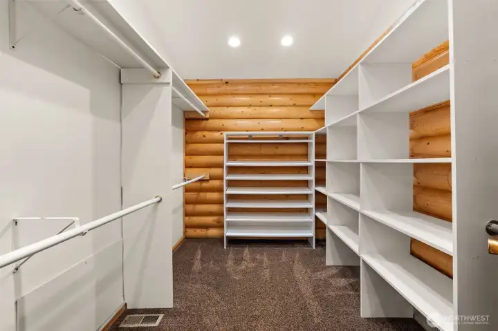 Walk-in closet with built-in shelving in primary
