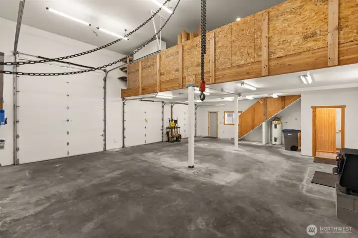 Inside you'll find a 3 ton chain fall, built-in air compressor, and a woodstove if you warm in the winter