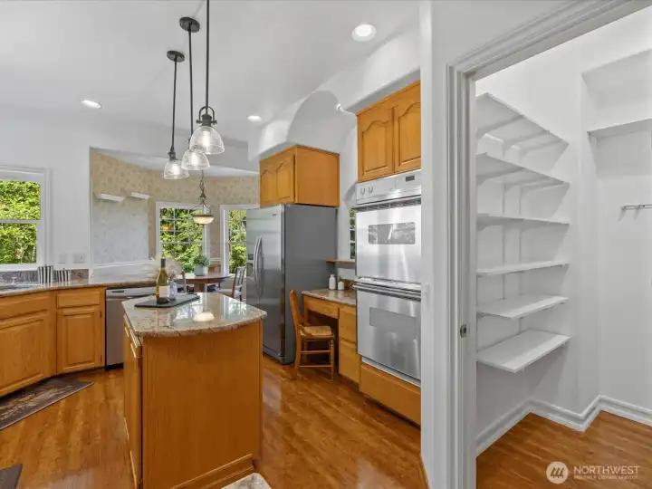 Island, built-in desk, and walk-in pantry