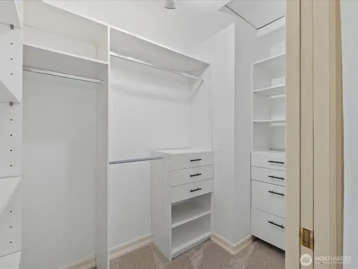 Built-in custom walk-in closet with barn door