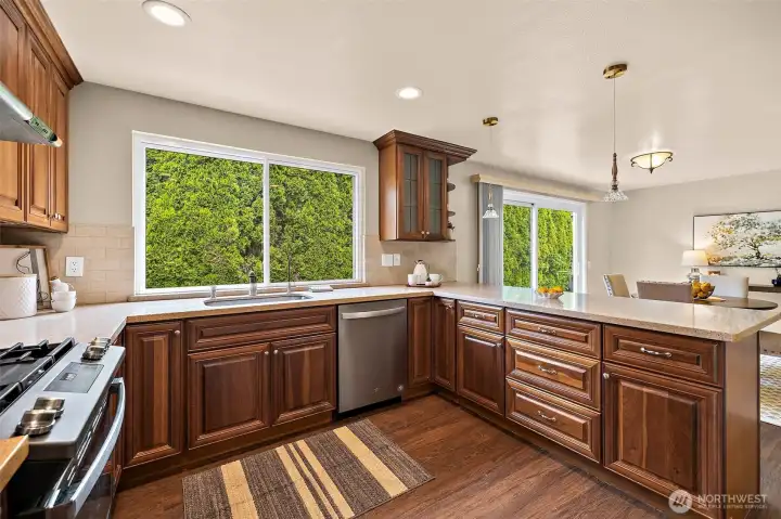 Updated kitchen with gas range and quartz countertop