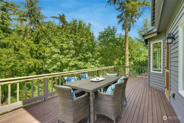 Large deck off the kitchen has gas outlets for your BBQ. Enjoy dining al fresco while you look over the gorgeous backyard.