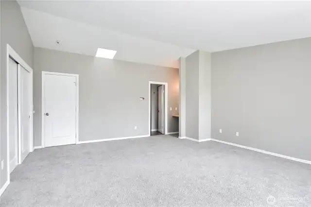 Primary bedroom (with the windows and deck to your back in this photo).