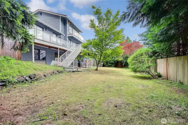 Private lot. Secluded dead-end road. This photo is from southwest corner of the lot. Check out the majesty of this home! Also, to the left looks "just" like fence, but it's a super cute tree house!!