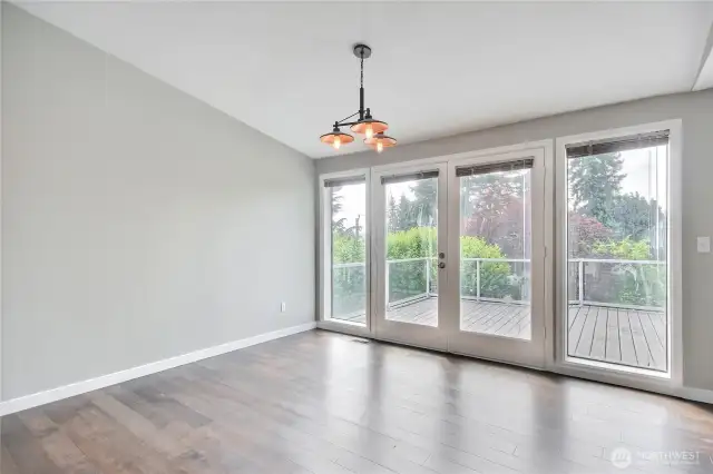 Vaulted ceilings, tons of window coverage and that lovely deck space (just about 1/4 of the deck shows here).