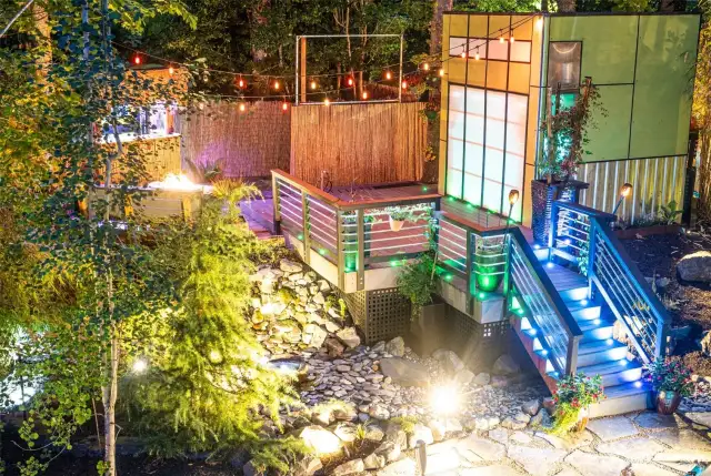 Studio/office features a loft and a flexible door that opens to a covered outdoor space—ideal for gatherings or soaking in the natural surroundings.