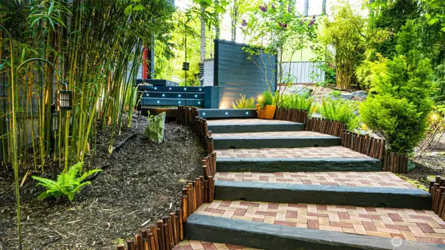 Sustainably sourced brick steps lead to the front door, offering an eco-conscious welcome that reflects the thoughtful design  found throughout the home.