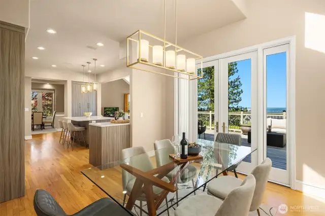 Adjacent to the kitchen is the informal dining area, with French doors opening to the deck. A wonderful place to enjoy the sun, and the views.