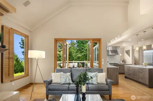 The family room is nicely connected to the kitchen. A second set of French doors opens to the deck. Lots of windows let the natural light flood in.