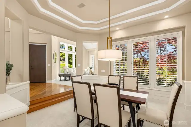 Plantation shutters, and tray ceilings add another level of sophistication to the dining room.