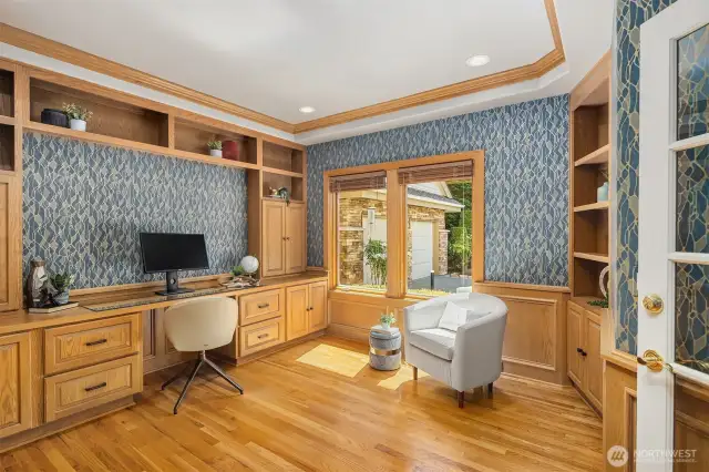 The main floor den has so much storage and incredible design details including a modern wallpaper finish.