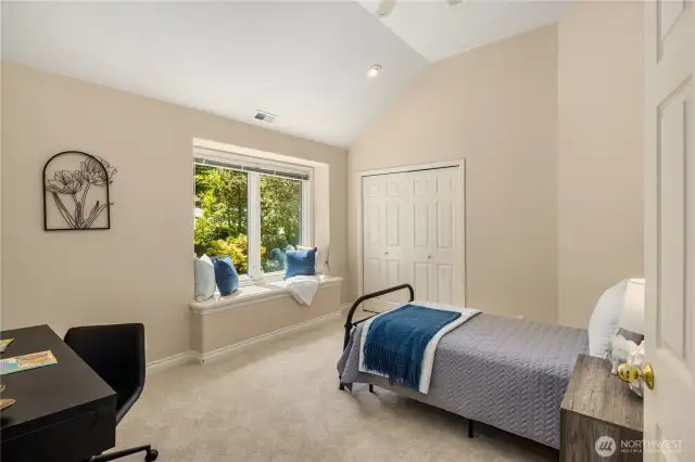 Adorable additional bedroom with built in bench. Staged with a twin but room for larger.