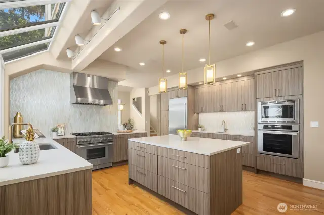 The remodeled kitchen is the heart of the home, carefully designed for everyday cooking, as well as a social gathering space, while also taking full advantage of the views of the Cascade Mountain range