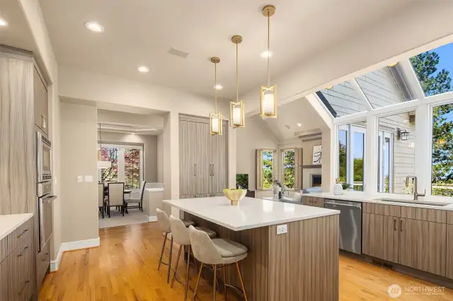 Designer lighting, plenty of cabinets space and large windows that fill the room with sunlight.