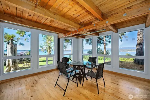 Dining area with corner windows for wrap around water/mountain views.