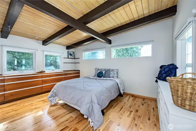 One of two bedrooms with wood floor and beautiful built ins.