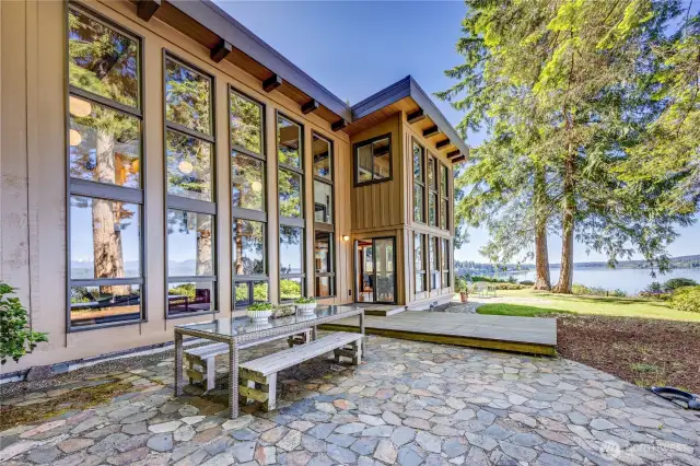 Another view of the patio, deck and the waterside of the home.