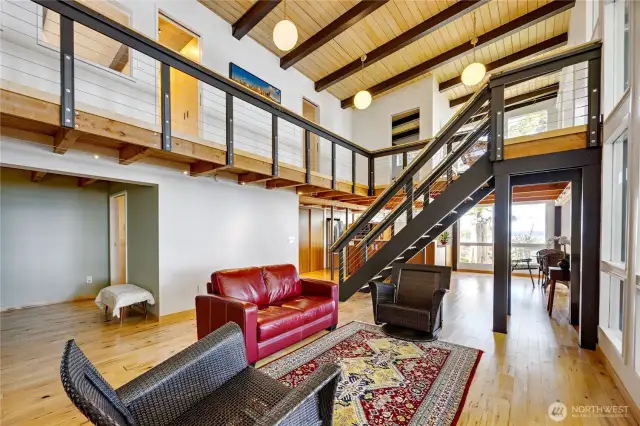 Main floor has a soaring ceiling, here is a view of the upstairs areas.