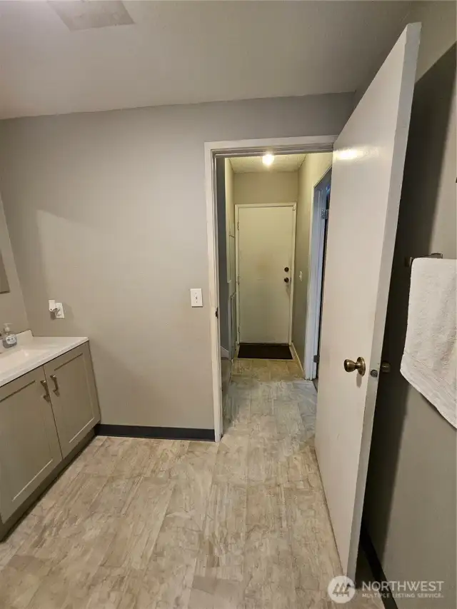Exit Powder/ Half Bath (Sink - Au Toilet) and Turn Right Family Room/Bonus Room - Straight past sink, Enter Door Washer and Dryer Included with Home Purchase