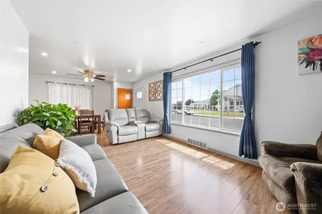 Large front window lets in lots of natural light to the living and dining spaces.