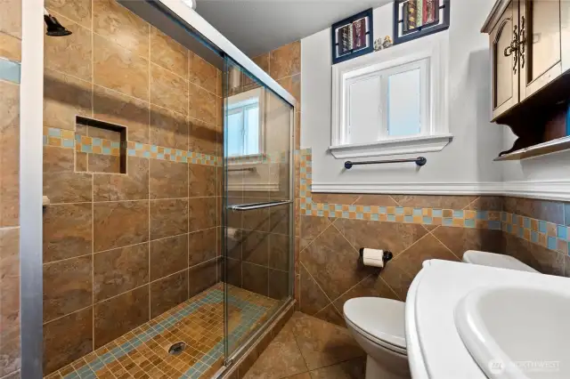 Beautifully tiled main floor bathroom.