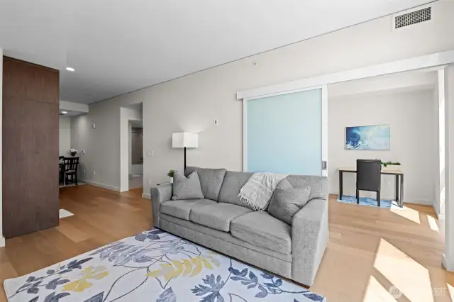 Living room with slider door for separation.
