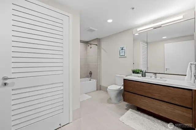 Designer tile bath surrounds and flooring.