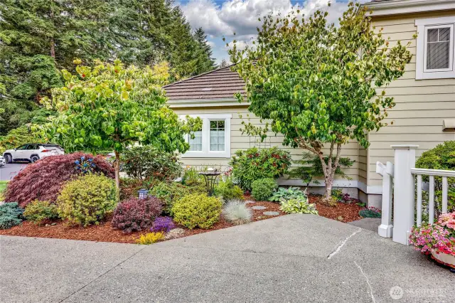Lovely Landscaping and just steps to you new home.